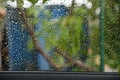 Wet texture of car window shot from inside in rain Royalty Free Stock Photo