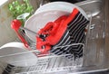 Wet umbrella is drying in a dish rack. Royalty Free Stock Photo