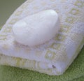 White soap bar on a bath towel Royalty Free Stock Photo