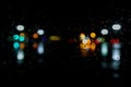 Wet the window with night rain and town lights background Royalty Free Stock Photo