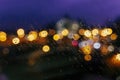 Wet window with rain drops, blurred street bokeh. Abstract blurred colorful background. Concept of weather, seasons Royalty Free Stock Photo