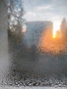 wet window after rainfall in the sunset