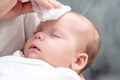 Wet wipe brings relief to newborn, Concept of maternal instinct during health concerns Royalty Free Stock Photo