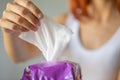 Wet wipes: woman take one wipe from package for cleaning
