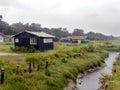 Wet wooden fisherman huts, sad and rainy weather. Ocean, Ile d\'Oleron, France