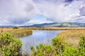 Wetlands in the South San Francisco Bay Area on a stormy spring day; Diablo Range mountains visible in the background; San Jose, Royalty Free Stock Photo