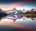 Wetterhorn and peak reflected in water surface of Bachsee lake. Royalty Free Stock Photo