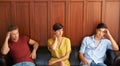 Weve been waiting a long time. Portrait of three bored-looking young people sitting on a sofa.