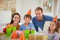Weve got a lot to celebrate. Portrait of a happy family having a birthday party at home. Royalty Free Stock Photo