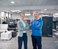 Weve got production sorted. Portrait of two colleagues standing together in a printing factory. Royalty Free Stock Photo