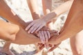 Weve got the team spirit. Shot of a group of unrecognizable people stacking their hands.