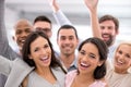 Weve made it to the big time. a group of businesspeople smiling and raising their hands. Royalty Free Stock Photo