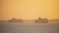 WEYMOUTH, DORSET, 3 APRIL 2021 - P&O Cruise Ship leaving Weymouth during glorious orange peaceful sunset