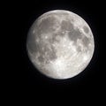 White glowing moon lights night sky Royalty Free Stock Photo