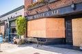 The Whale and Ale boards up glass windows in local business district of San Pedro, CA