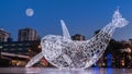 Whale installation lights with full moon background, English bay beach Vancouver Canada