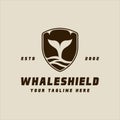 whale tail of shield logo vintage vector illustration template icon graphic design. humpback sign or symbol for nature ocean