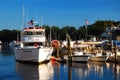 A whale watch ship is docked at a small harbor Royalty Free Stock Photo