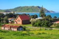 The small coastal village of Whangara, New Zealand, with historic church Royalty Free Stock Photo