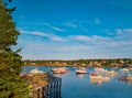 A wharf in Bass Harbor, Maine overlooks fishing boats in the bay. Royalty Free Stock Photo