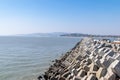 The wharf of the fishing village and the dam made of stones Royalty Free Stock Photo