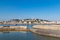 The wharf of the fishing village and the dam made of stones Royalty Free Stock Photo