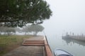 Wharf in quit bay, foggy weather, italian island Burano, province of Venice, Italy. Royalty Free Stock Photo