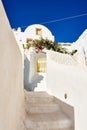 What amazing architecture. a beautiful constructed white building with steps running down the side outside during the