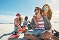 What an awesome day out in the desert. a group of young friends sandboarding in the desert. Royalty Free Stock Photo