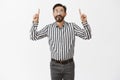 What beautiful day to make more money. Portrait of carefree joyful rich man with beard in fancy striped shirt and pants Royalty Free Stock Photo