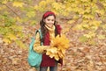 What a beauty. teen girl carry backpack on way to school. child walk in autumn forest or park. fall seasonal weather Royalty Free Stock Photo