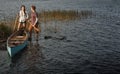 What better bonding experience than canoeing. a young couple going for a canoe ride on the lake.