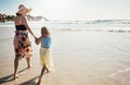 What a blissful day at the beach. Rear view shot of a mother and her little daughter bonding together at the beach. Royalty Free Stock Photo