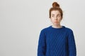 What a bummer. Portrait of frustrated attractive redhead caucasian female student in winter sweater sulking and looking