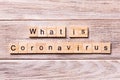 What is coronavirus word written on wood block. what is coronavirus text on wooden table for your desing, coronavirus concept top Royalty Free Stock Photo