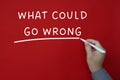 What could go wrong text on red cover background.