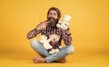 what a cute. cheerful bearded man hold teddy bear. male feel playful with bear. brutal mature hipster man play with toy Royalty Free Stock Photo