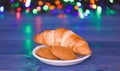 What do kids around world leave for Santa. Croissant and oat cookies on white plate. Winter holiday tradition. Sweets Royalty Free Stock Photo
