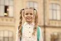 What do you know. First day of school. Happy schoolgirl urban background. Little schoolgirl back to school. Small