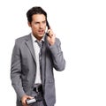 What do you mean. An angry young businessman shouting into a phone receiver - isolated. Royalty Free Stock Photo