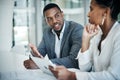 What do you think is the best way forward. two young businesspeople sitting in the office together and having a Royalty Free Stock Photo