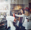 What do you think. two best friends out shopping in a clothing store. Royalty Free Stock Photo