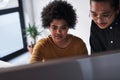 What do you think of this. two young businesspeople working on a computer together in the office during the day. Royalty Free Stock Photo