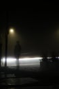 Alone in the dark foggy street Royalty Free Stock Photo