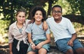 What fun activity should we do next. a group of teenagers sitting on a tree trunk at summer camp. Royalty Free Stock Photo