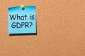 What is General Data Protection Regulation or GDPR - note at blue paper pinned to office cork board with copy space for