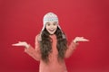 So what. Just want to have fun. Winter outfit. Cute model enjoy winter style. Small child long hair wear hat. Wintertime