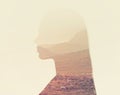 What lies within. Composite image of a rugged nature scene superimposed on a womans profile.