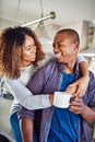 This is what love looks like. an affectionate young couple in their kitchen at home.