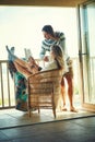 What a lovely lazy long weekend. a young couple reading a book together while relaxing on the balcony. Royalty Free Stock Photo